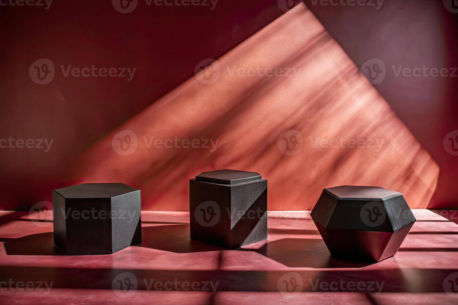 Geometric black shapes casting shadows on a red backdrop. photo