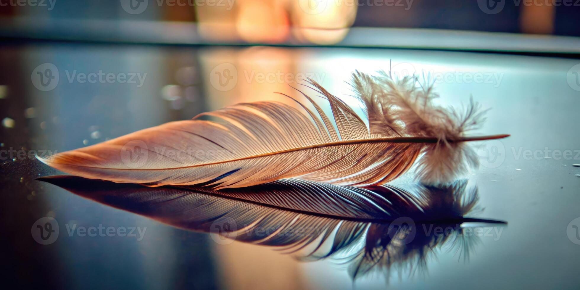 Delicate feather resting on a reflective glass surface. photo