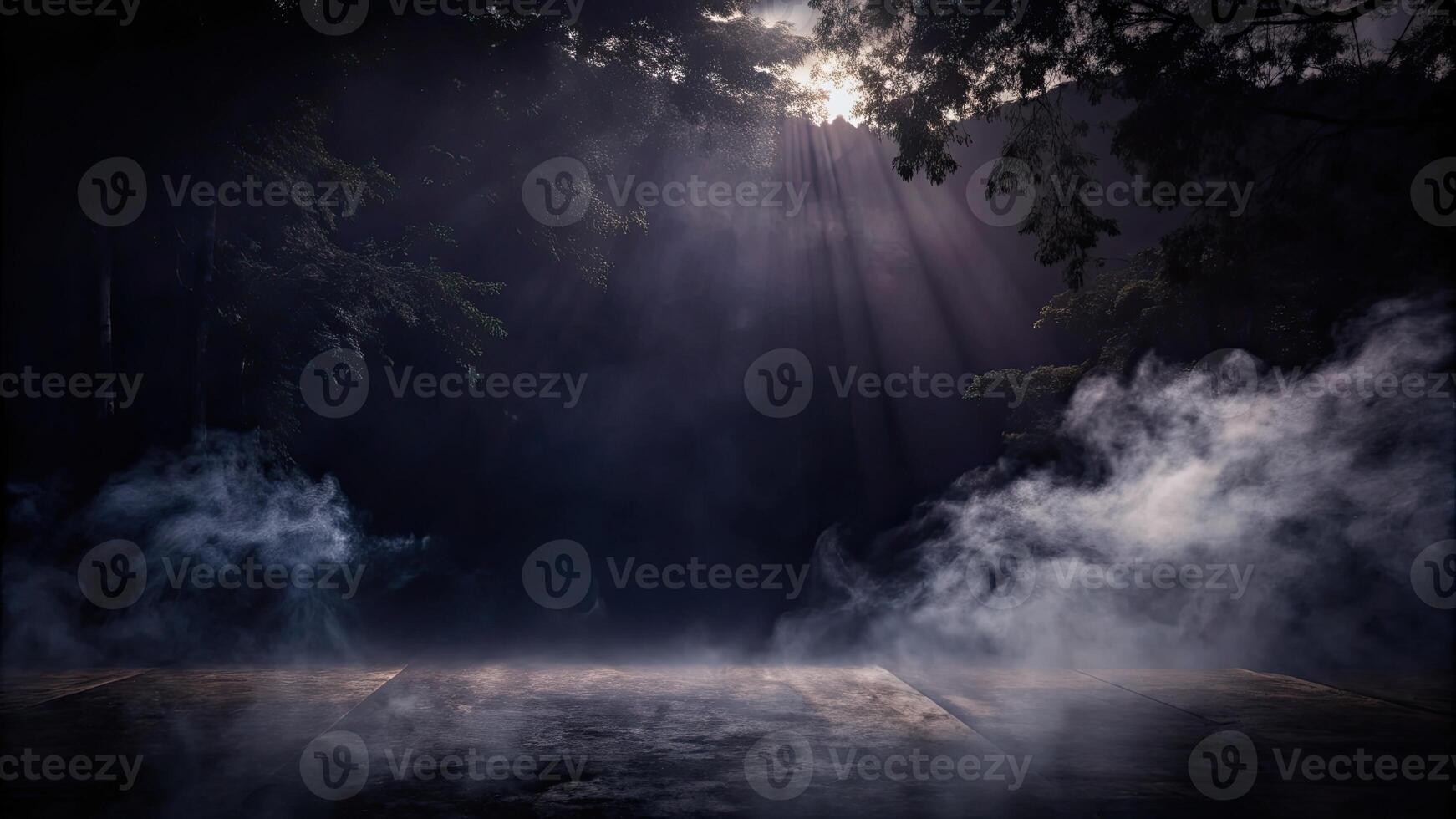 Dramatic foggy landscape with rays of light piercing through. photo