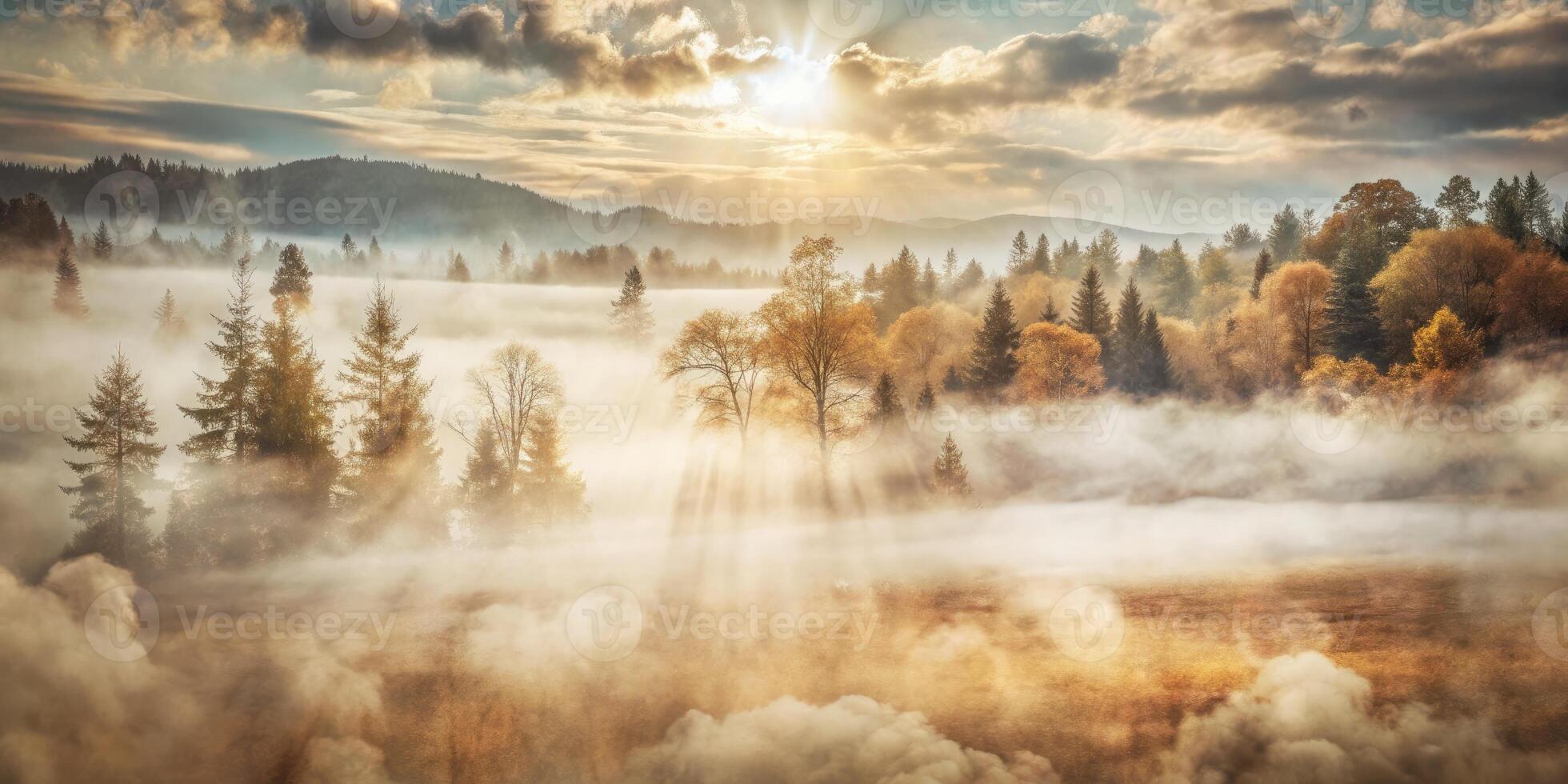 Scenic view of mountains with sunlight breaking through fog. photo