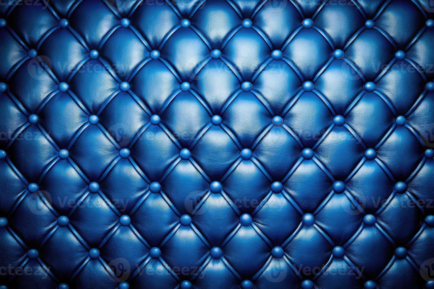 Quilted blue leather with deep button tufting. photo