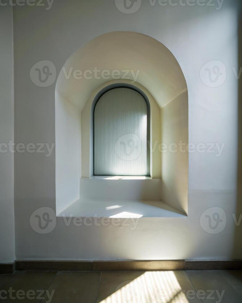 Sunlit arched alcove with minimalist shadows on white walls photo