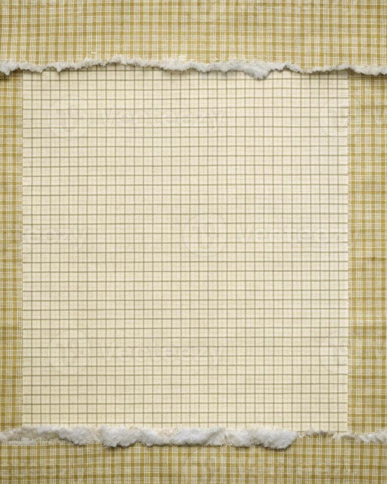 Torn grid paper with a vintage appearance. photo