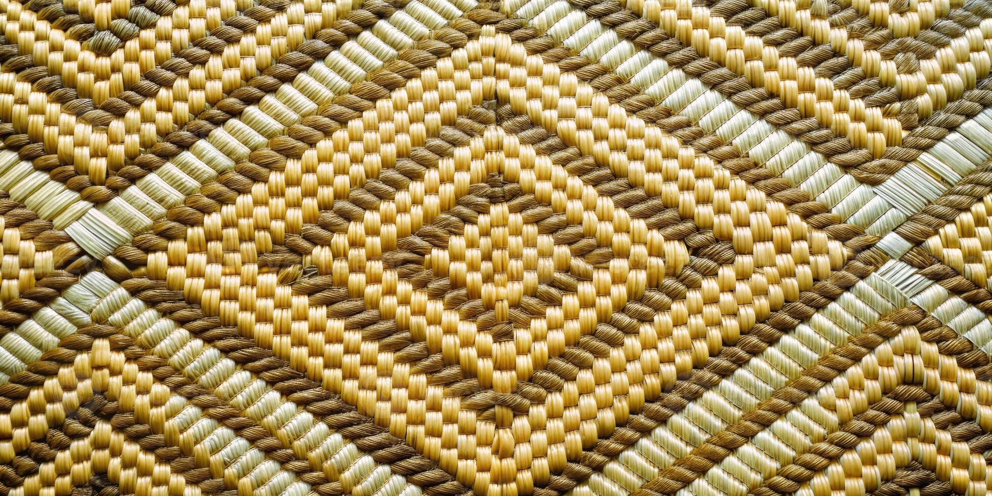 Geometric golden woven texture with intricate diamond patterns. photo