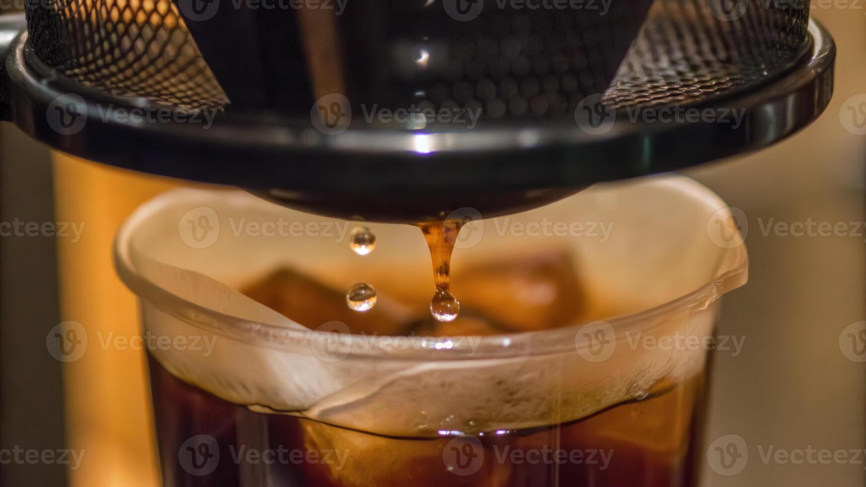 Pouring Freshly Brewed Coffee into Transparent Glass in Cozy Setting photo