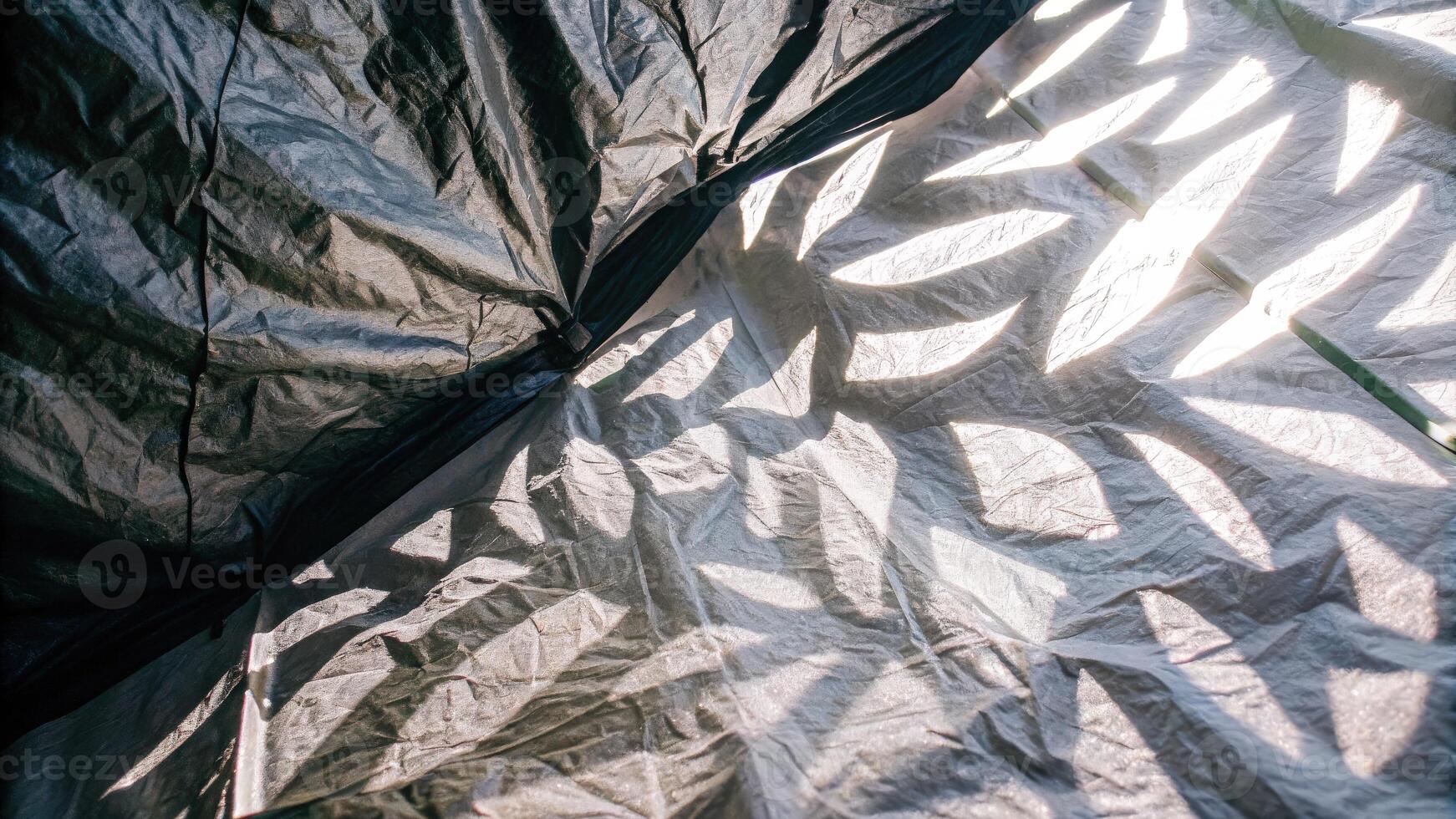 Intricate Shadow Patterns on Metallic Surface photo