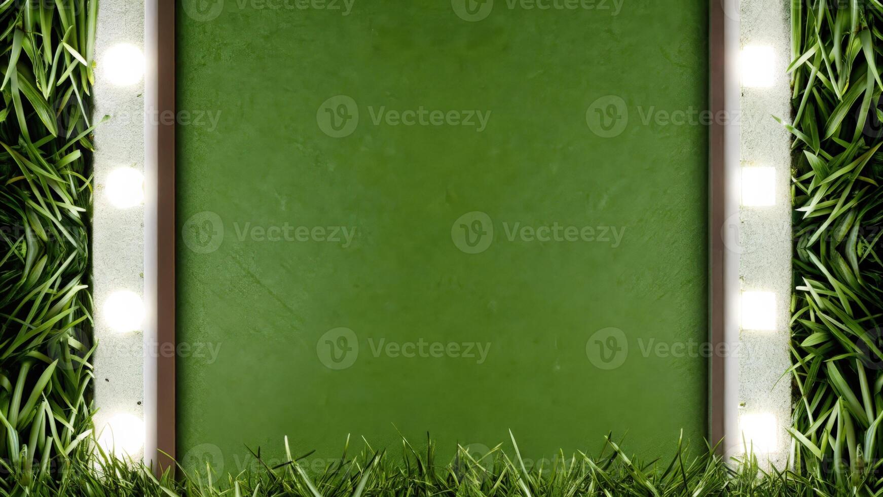 Green Chalkboard Framed with Lights Surrounded by Grass photo