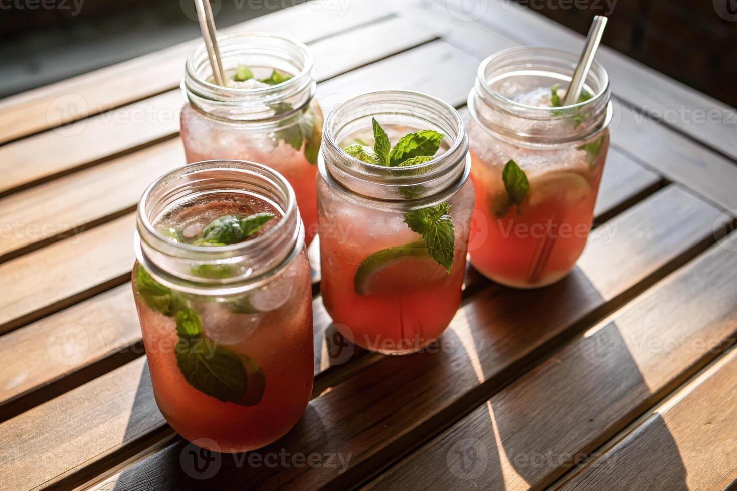 Refreshing Pink Lemonade in Mason Jars with Lime and Mint photo