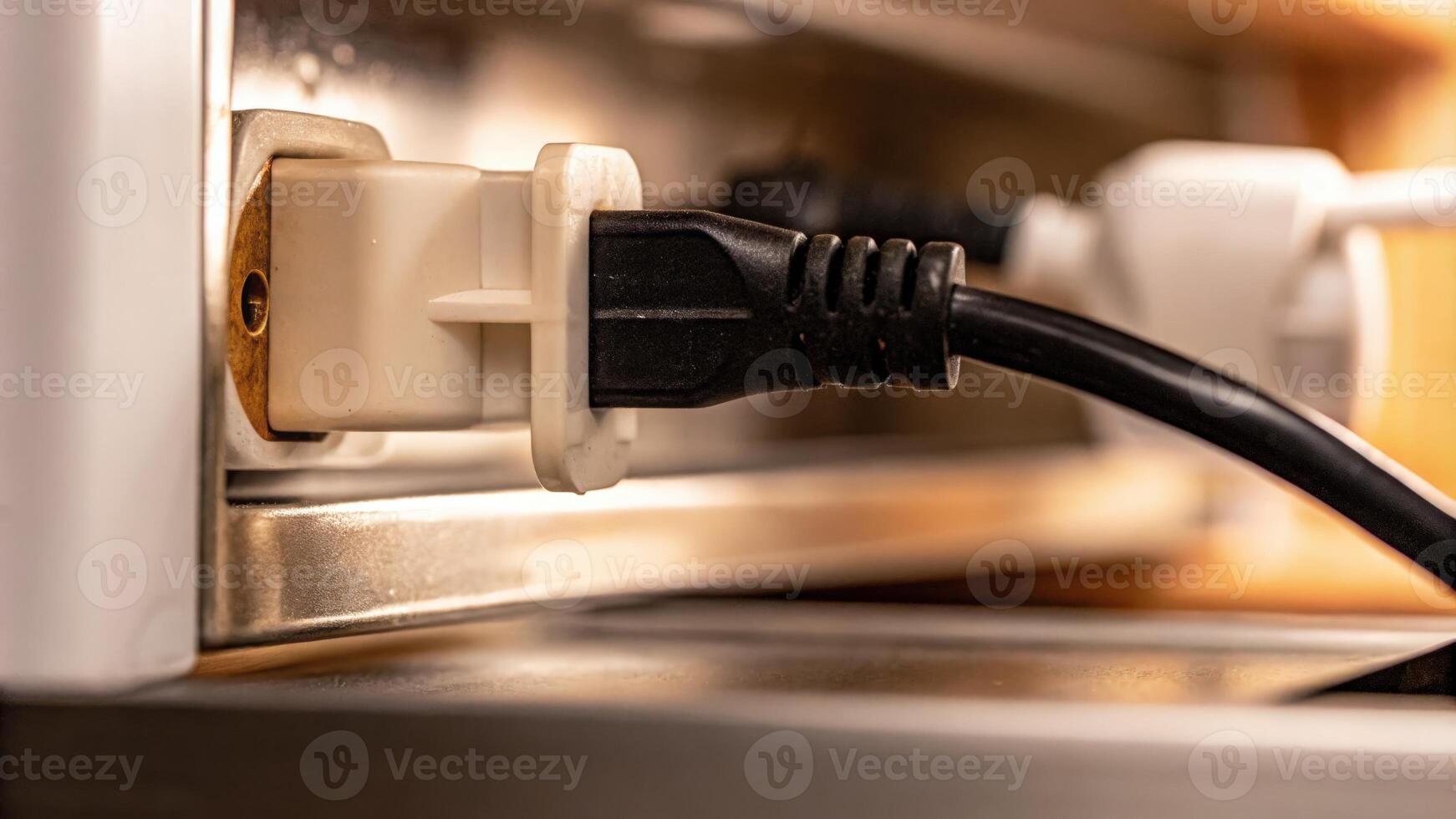 Close-Up of Electrical Plug Inserted into a Socket photo