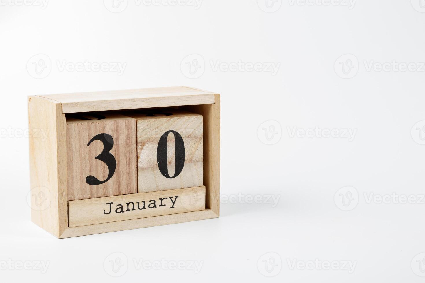 macro Wooden calendar January 30 on a white background photo
