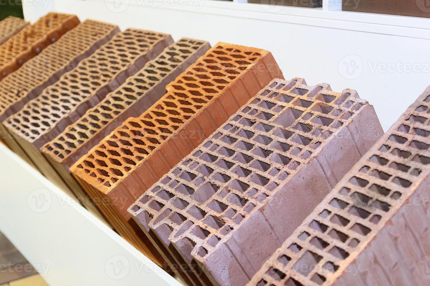 Samples of bricks on the showcase of a hardware store photo