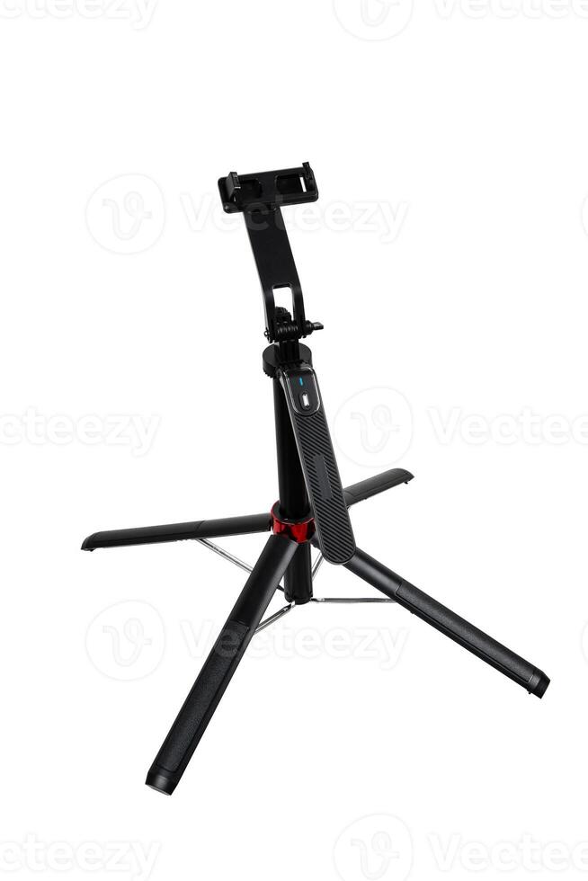 A height-adjustable stand with a smartphone clamp and a handy Bluetooth remote control. photo