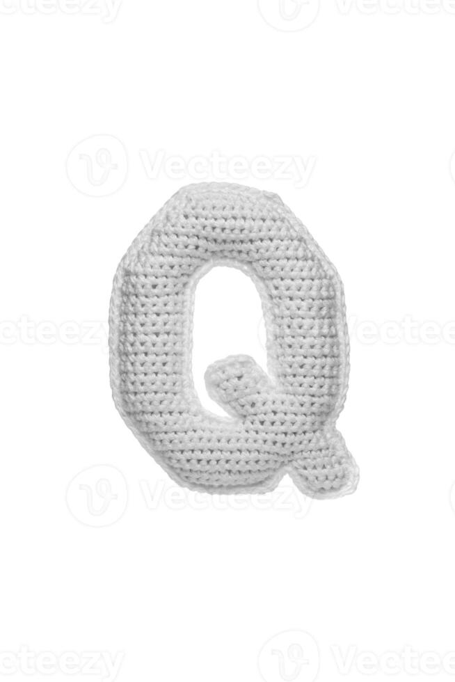 Handmade crocheted letter Q in light grey yarn, isolated on white back photo