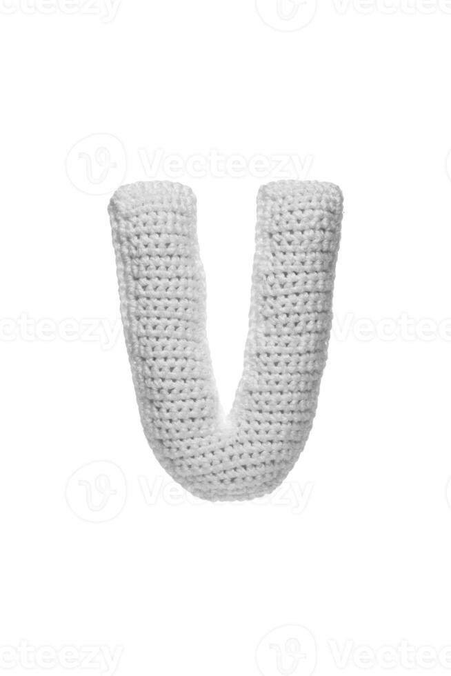 Handmade crocheted letter V in light grey yarn, isolated on white back photo