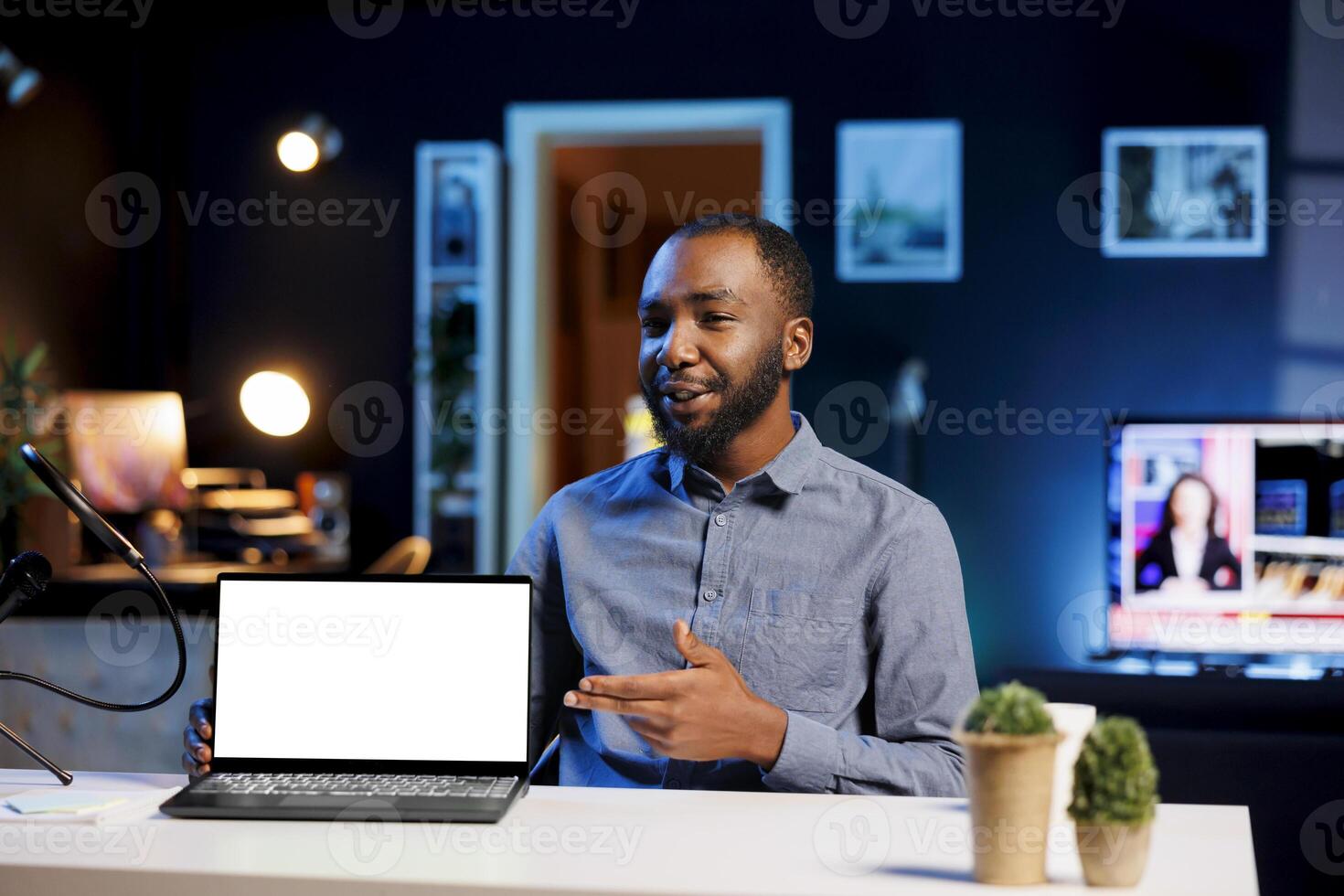 African american man filming himself watching internet videos on mockup laptop requested by viewers. Online influencer reacting to online clips sent by subscribers using isolated screen notebook photo