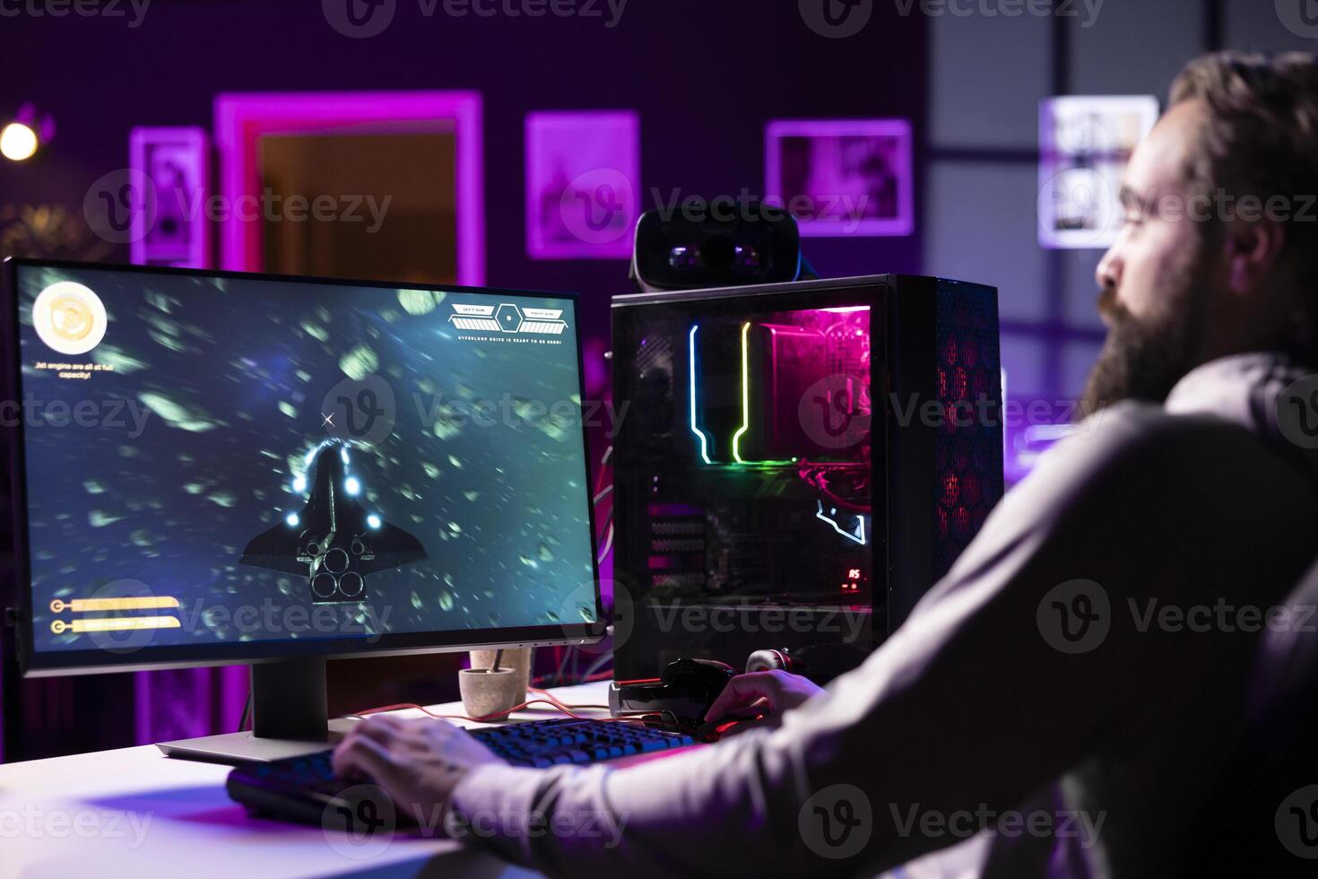 Man having fun by using gaming keyboard to fly spaceship in SF videogame, unwinding at home. Gamer using powerful PC and computer peripherals to play game, entertaining himself photo