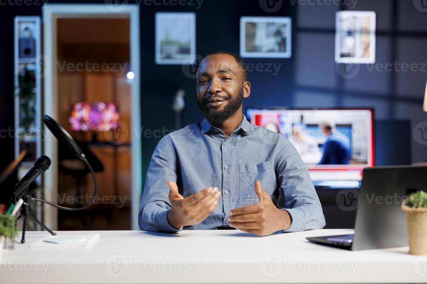 African american content creator doing story time type of for subscribers, filming in personal home studio. Internet show host telling viewers about interesting events, keeping audience engaged photo