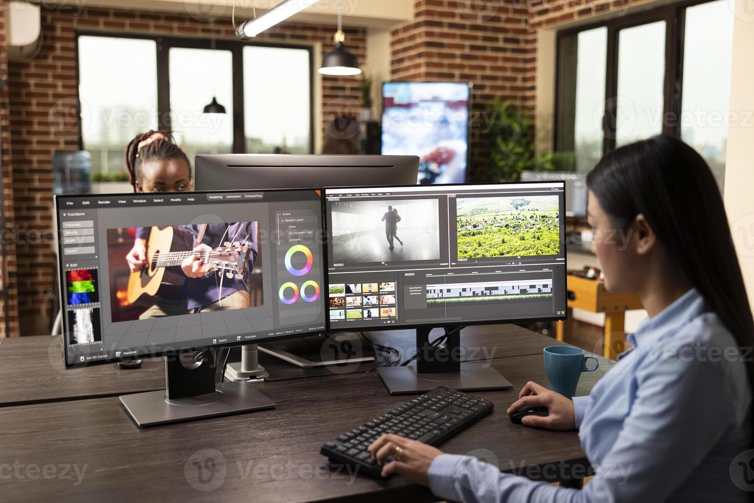Skilled female specialist edits raw content, applies motion graphics, and ensures high quality results in office. Asian woman seated with multiple screens, focused on adjusting cinematic visuals photo