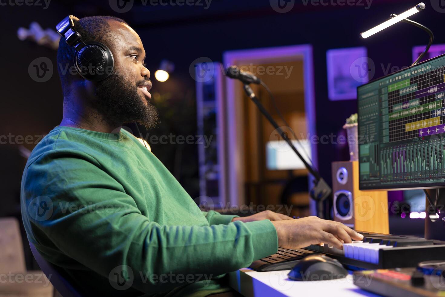 Music producer adding piano notes as tunes for a new melody, recording sounds on electronic synthesizer. Songwriter audio engineer editing and mixing soundtracks on a digital software. photo