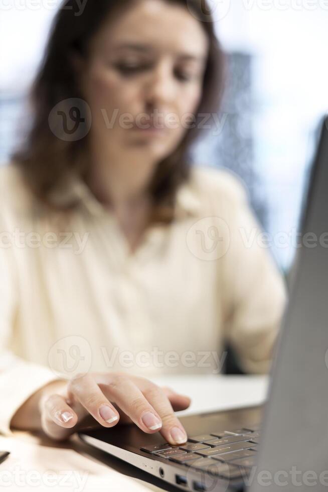 Young female general director working on corporate management, analyzing data driven analytics and performance metrics to ensure goals achievement. Executive power. Close up. photo