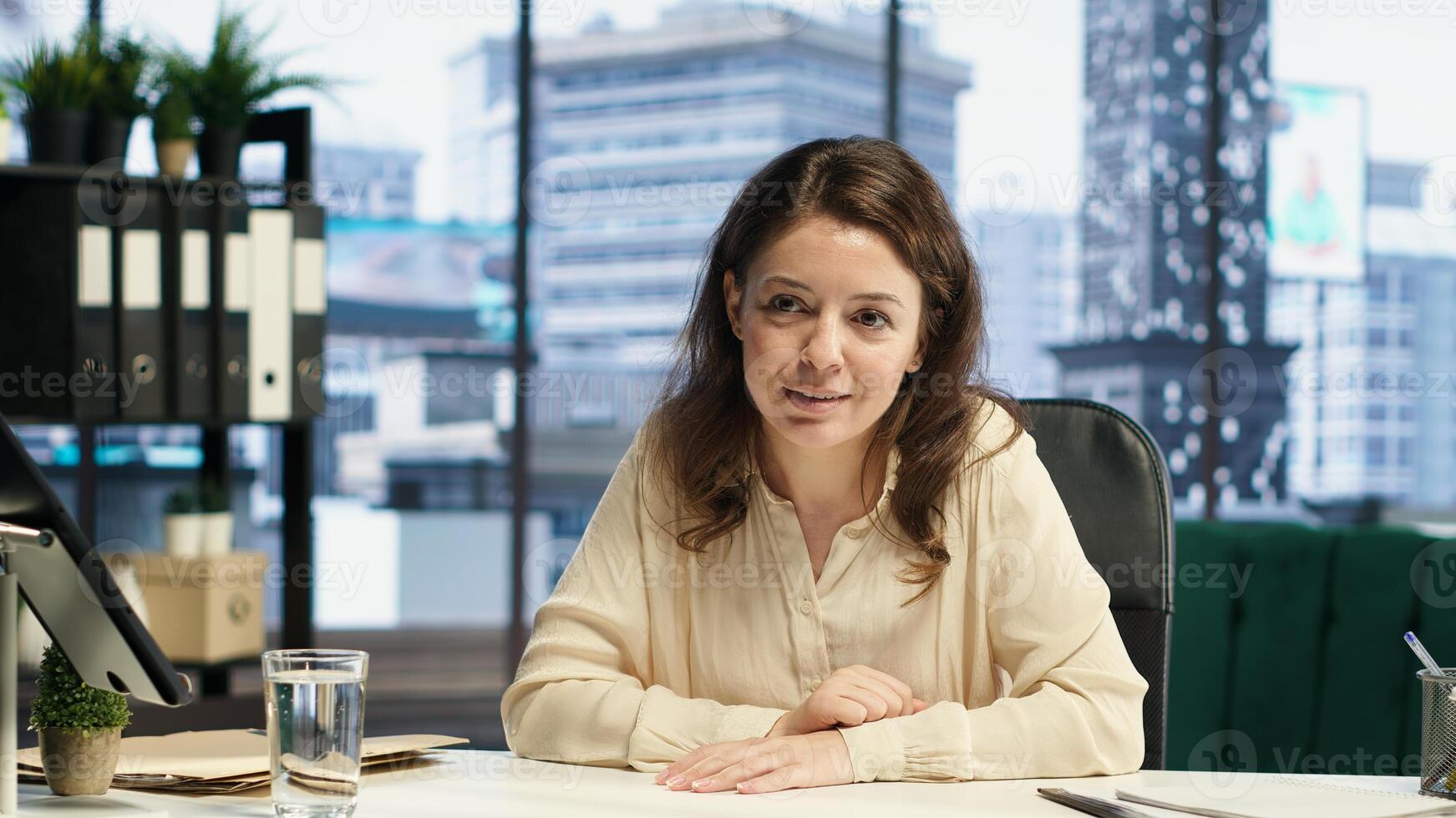 Successful inspirational female leader sharing her business goals and targets with the advisory board, discussing with partners on videocall about new funds for strategy. Leadership skills. Camera A. photo
