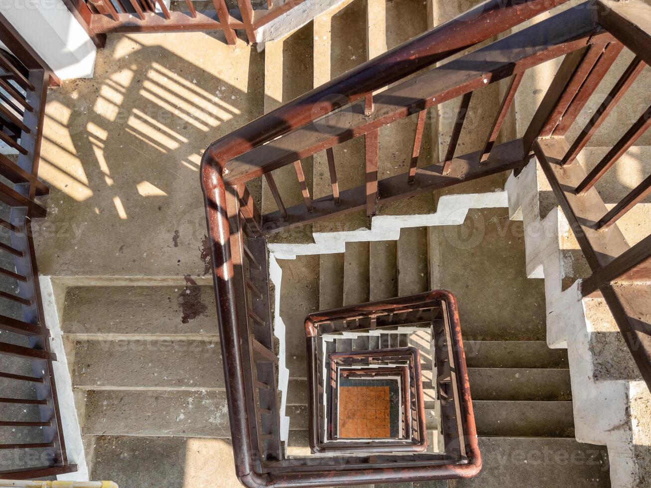 Top-Down View of a Spiral Staircase Inside a Bird-Watching Tower. photo