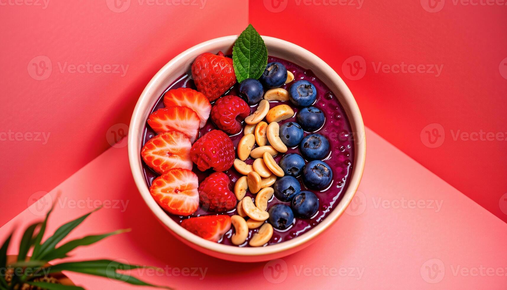Vibrant acai bowl set in the colorful corner on a coral background photo