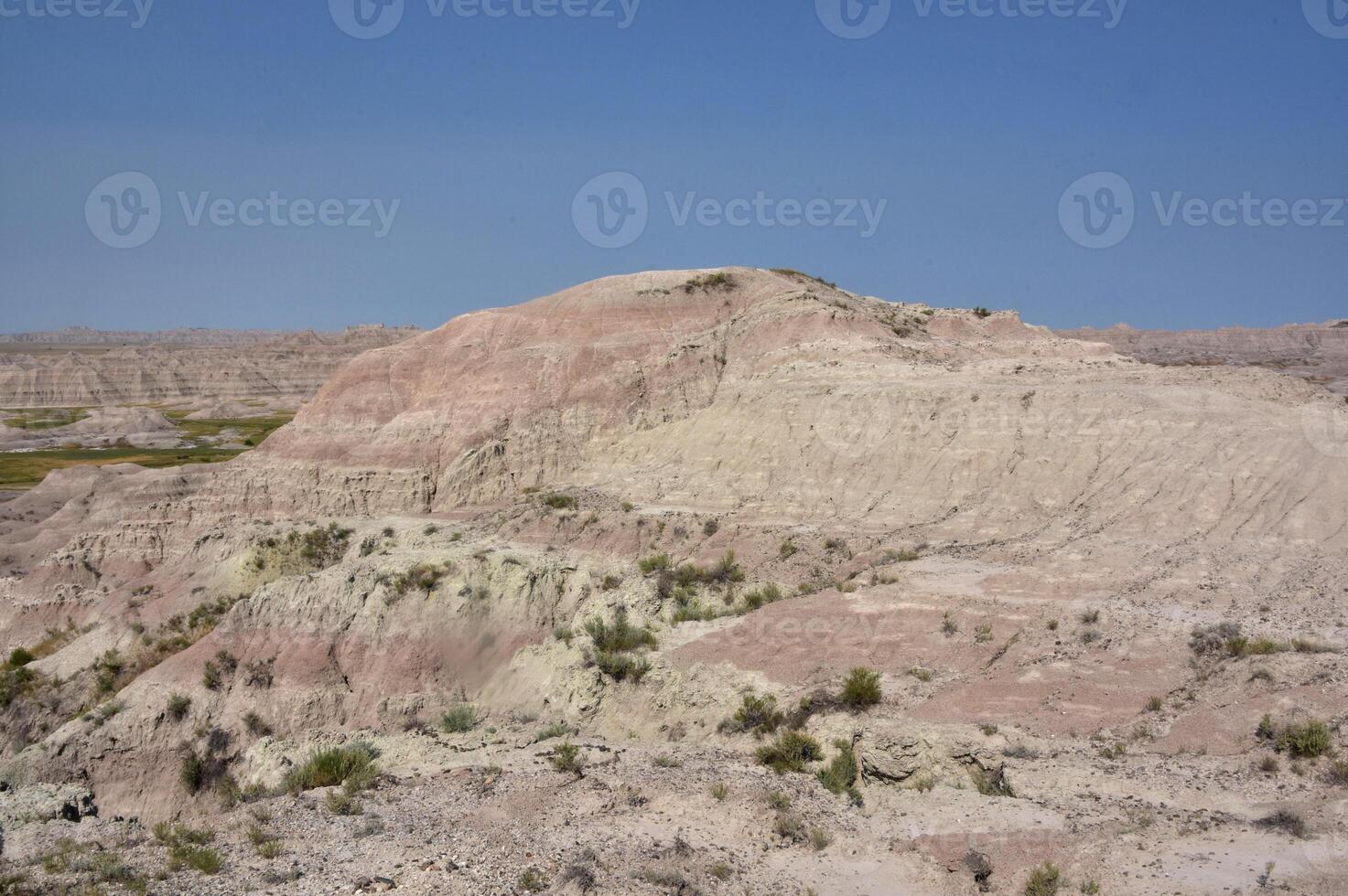 Sandstone Mound in the Rugged Badlands of South Dakota photo