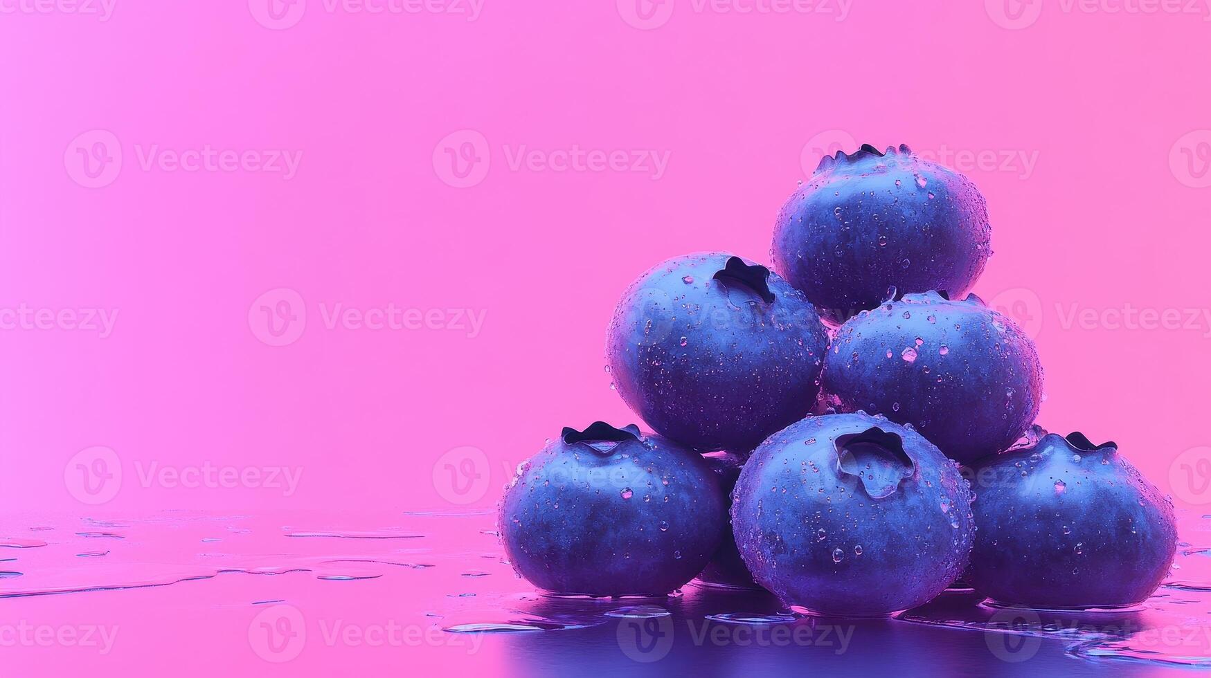 Colorful blueberries stacked with water droplets against a vibrant pink background in a creative setup photo