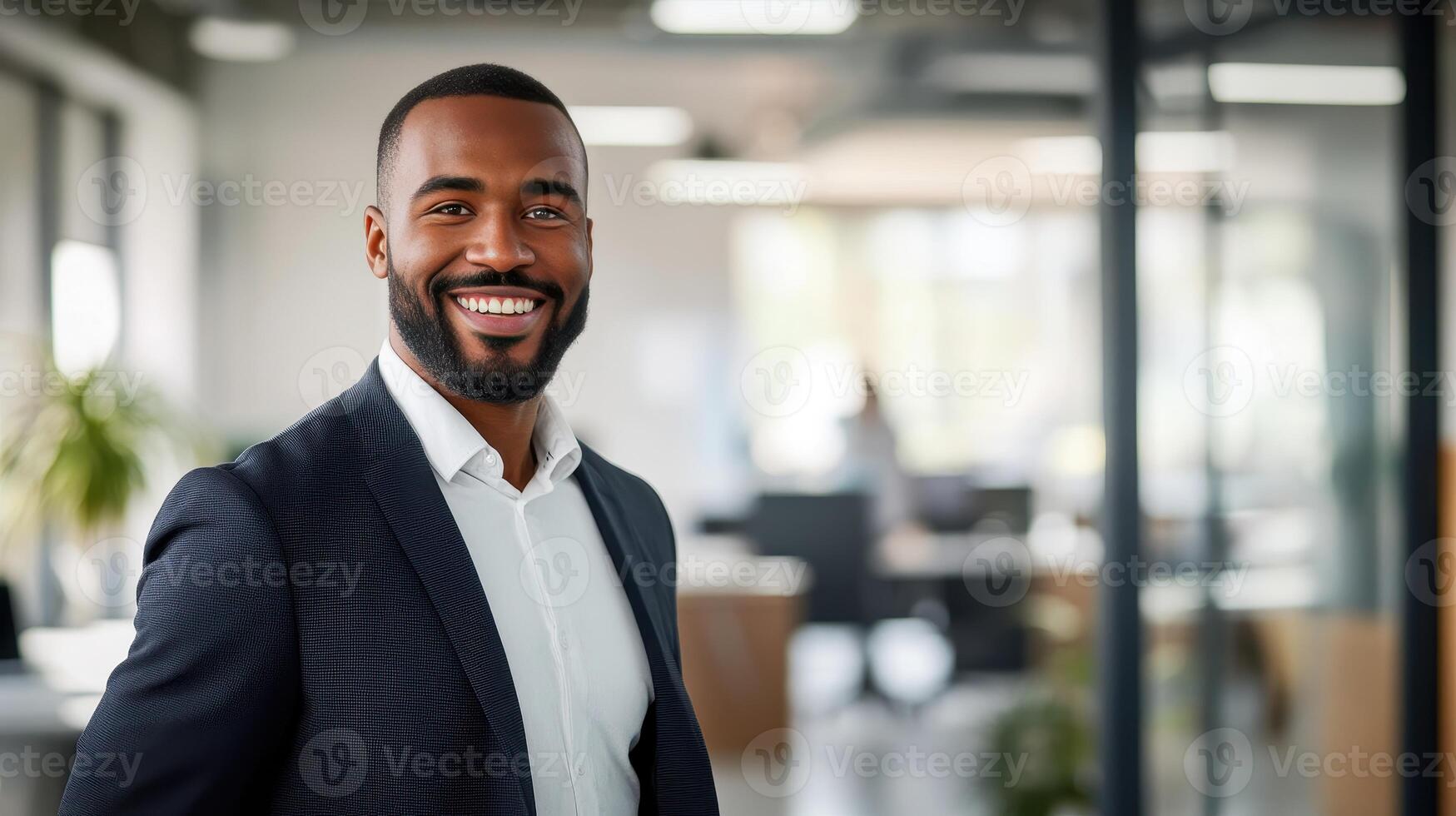 A smiling black man in a suit photo