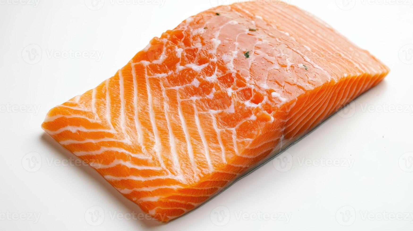 Fresh salmon fillet on a clean white surface ready for cooking or preparation in a modern kitchen photo