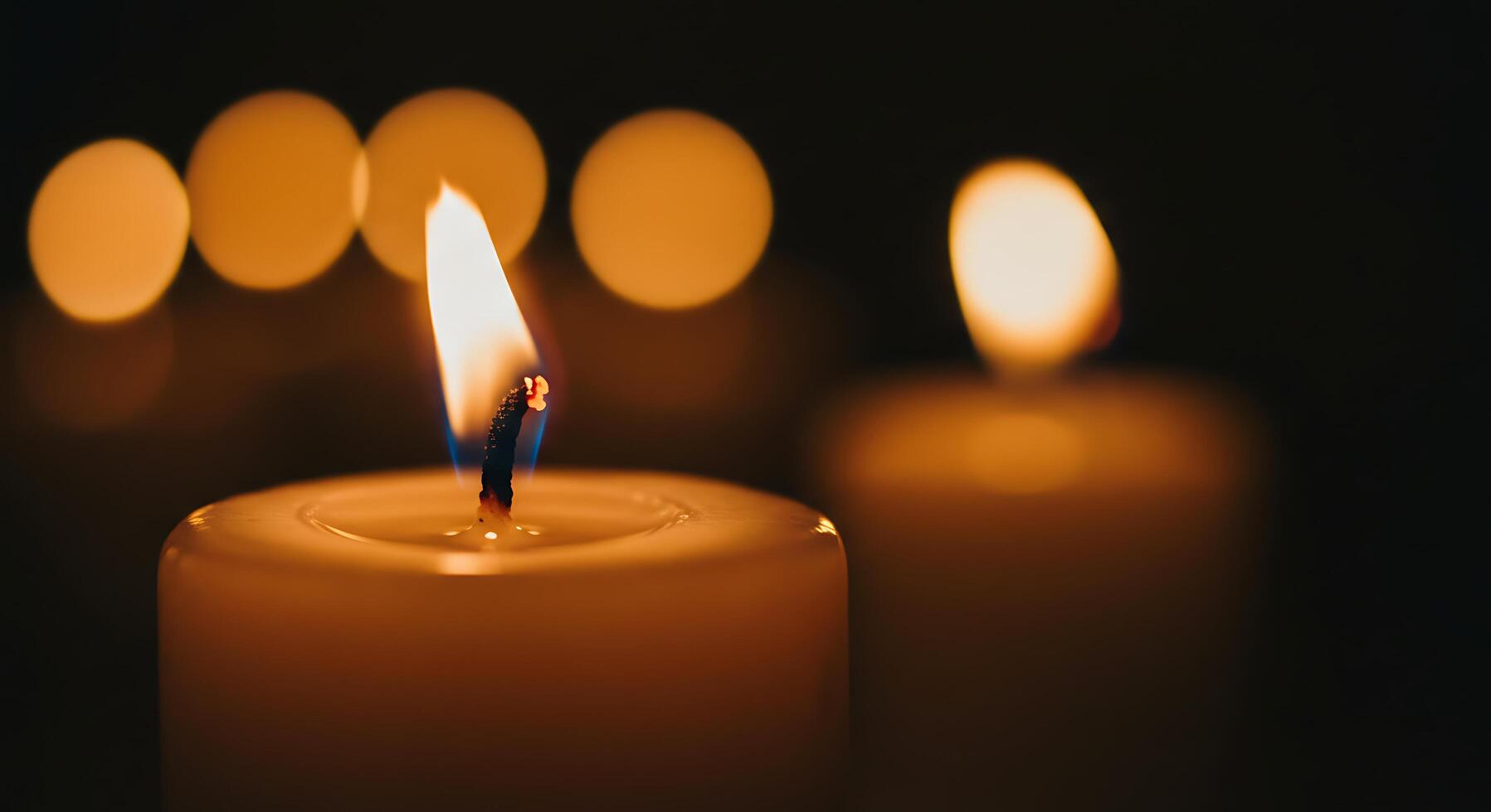 Candlelight Glow Two Candles Burning with Soft Bokeh Background Warmth photo