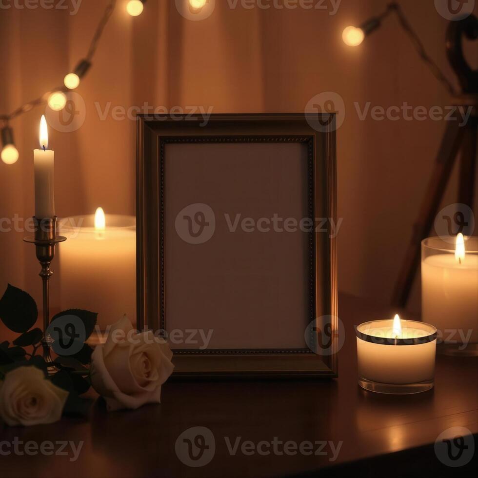 Candles and a frame with a blank photo on a table