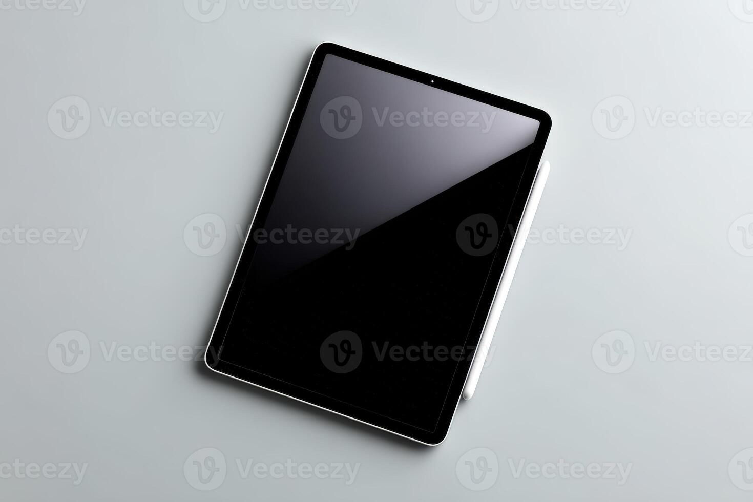 Modern tablet resting on a smooth surface during a quiet workspace moment photo