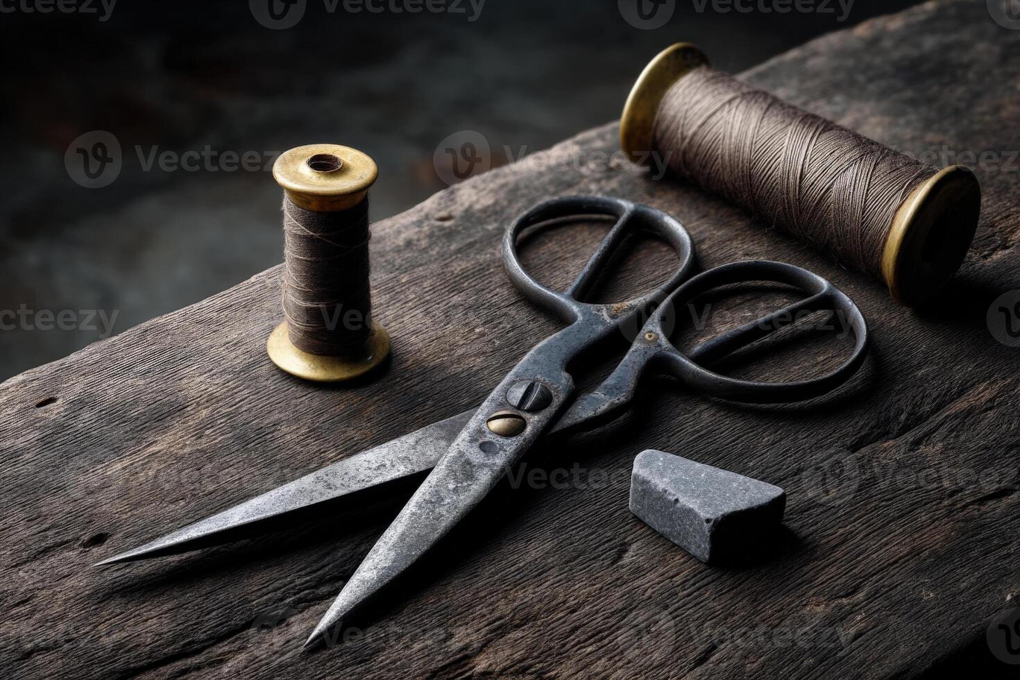 Crafting tools displayed on weathered wooden surface in a dimly lit environment photo