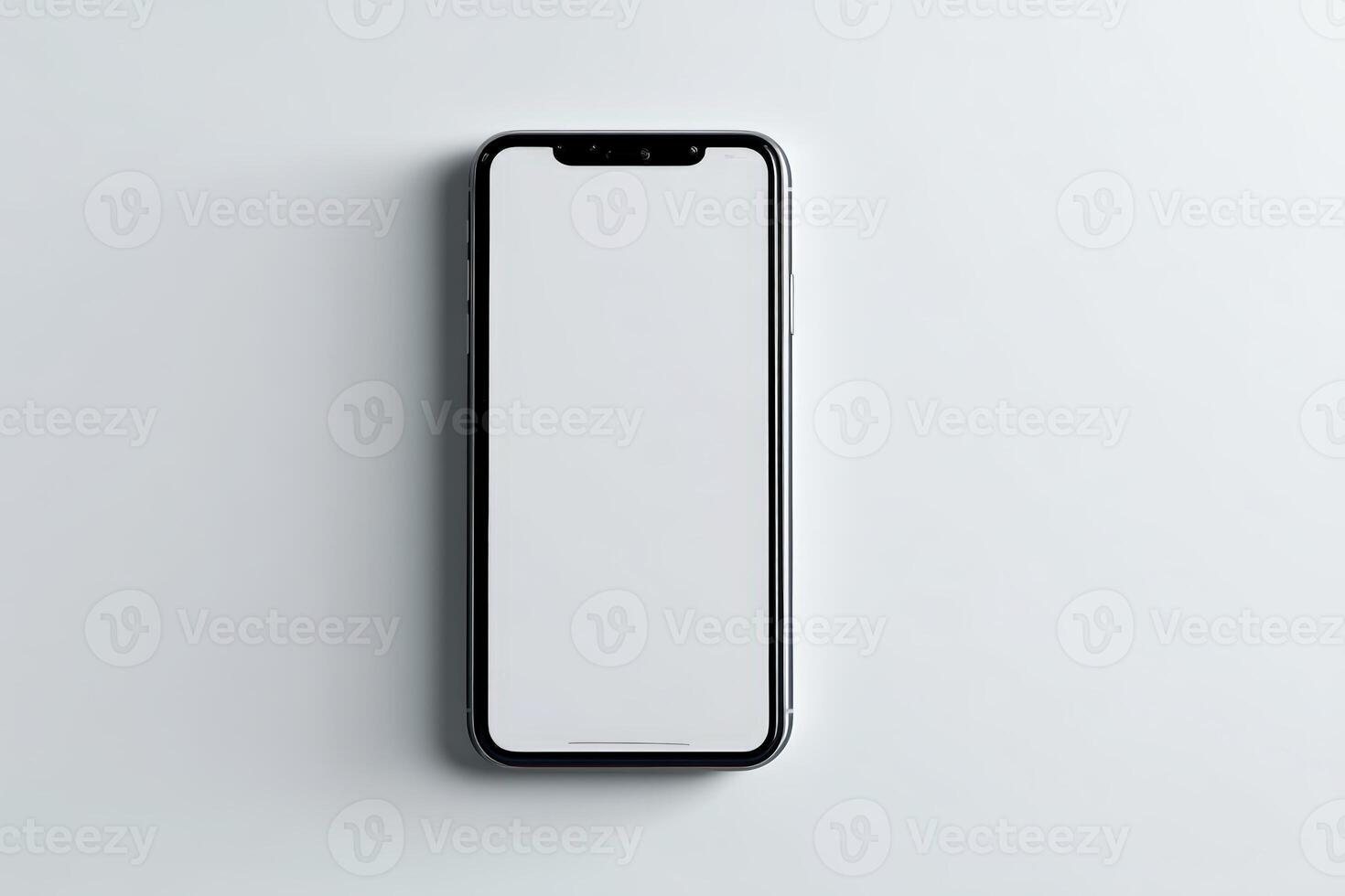 Modern smartphone laying flat on a light surface with an empty screen for design purposes photo