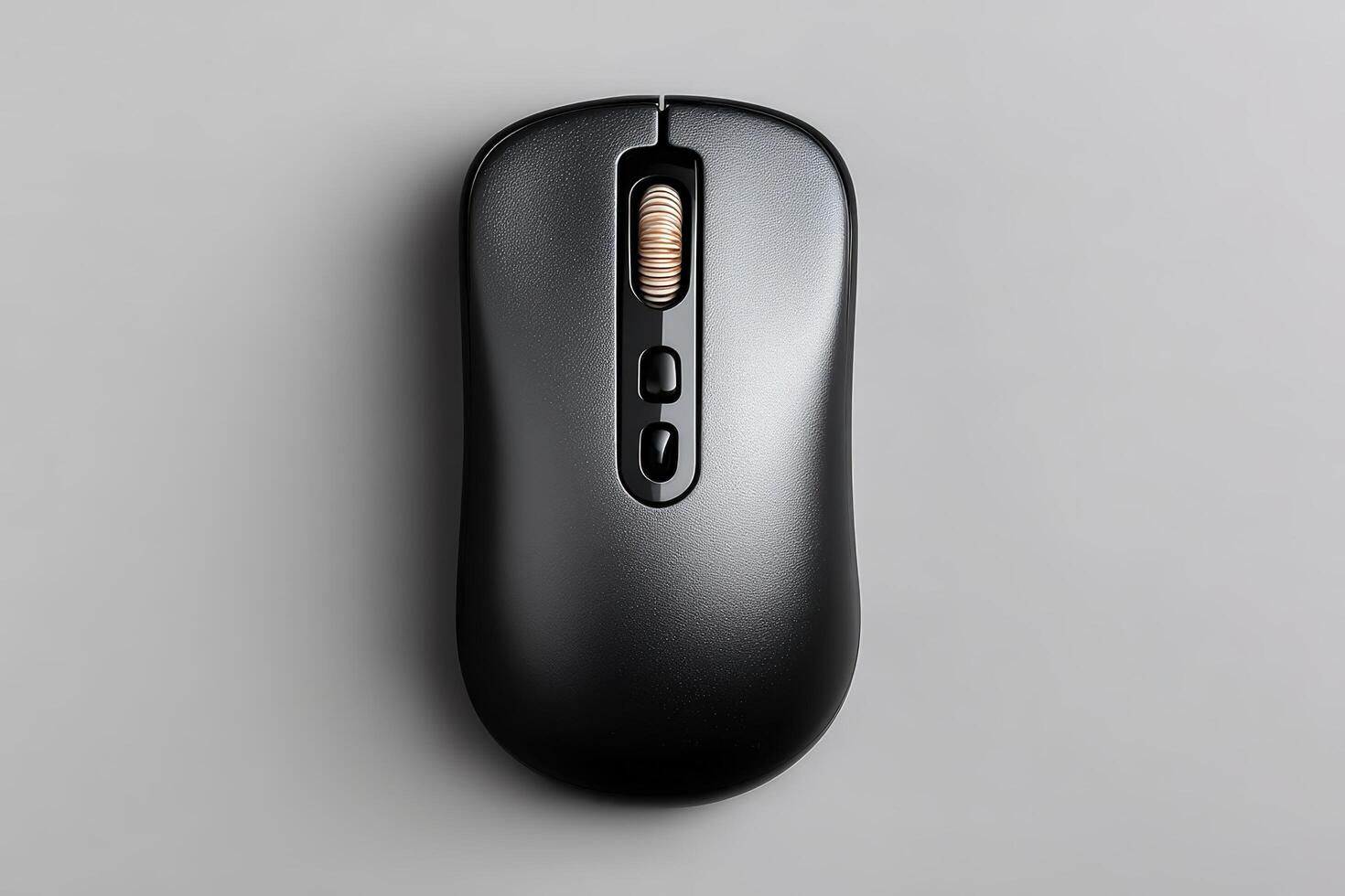 Wireless computer mouse in matte black placed on a smooth surface for easy access and use photo