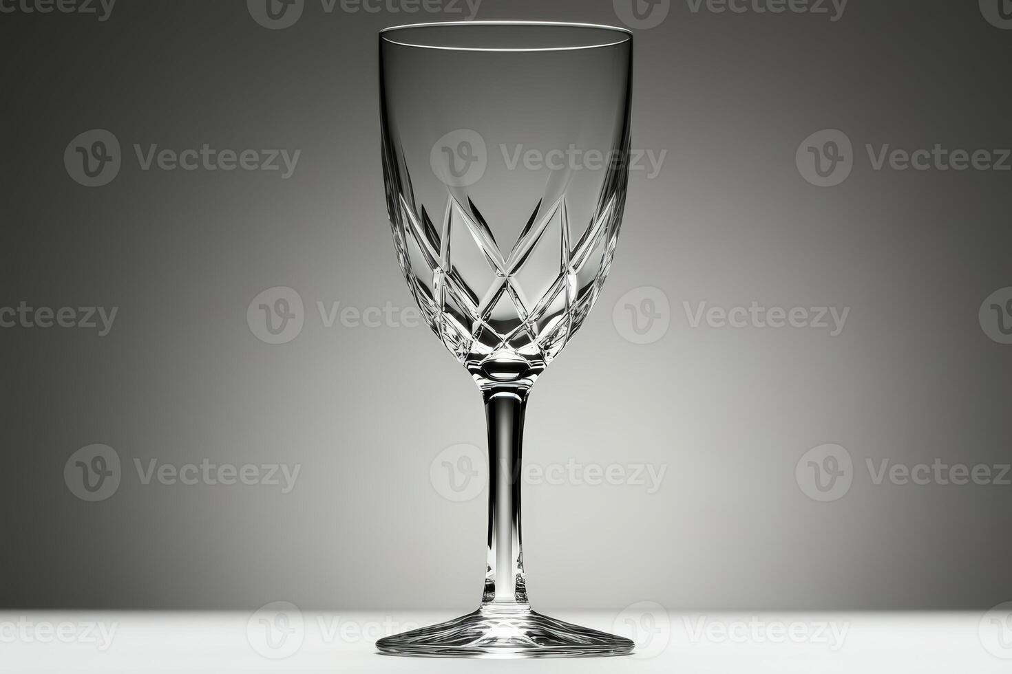 Elegant crystal glass displayed on a minimalist background with soft lighting effects photo