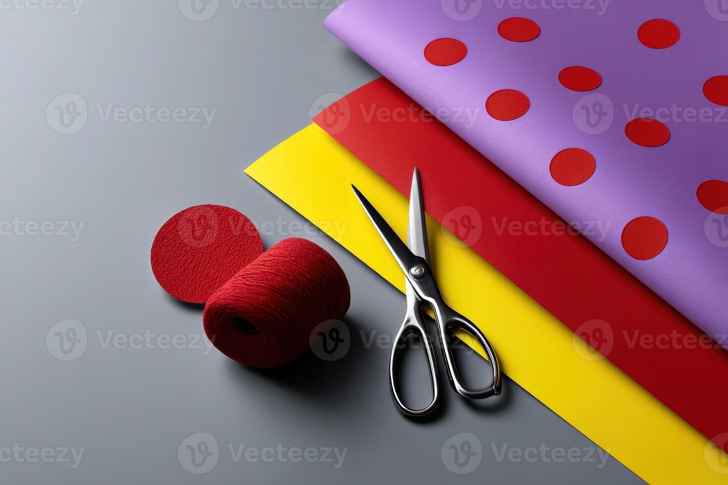 Colorful layered paper cut shapes and scissors arranged for creative crafting activities indoors photo