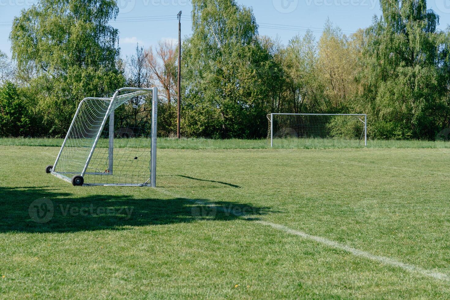 Empty Soccer Field with Separated Goalposts photo