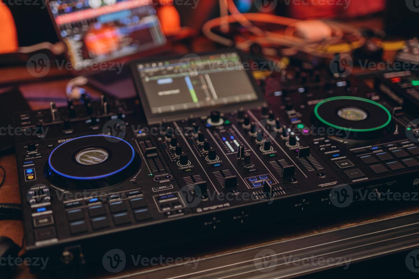 Close up DJ plays live set and mixing music on turntable console in the night club. Disc Jokey Hands on a sound mixer station at club party. DJ mixer controller panel for playing music and partying. photo