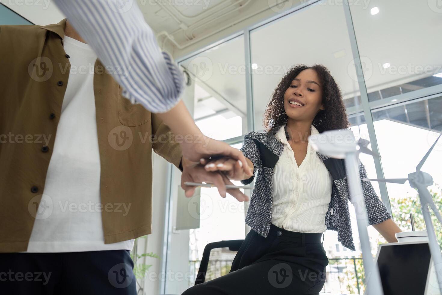 Sustainability engagement Professionals showcasing teamwork in office photo