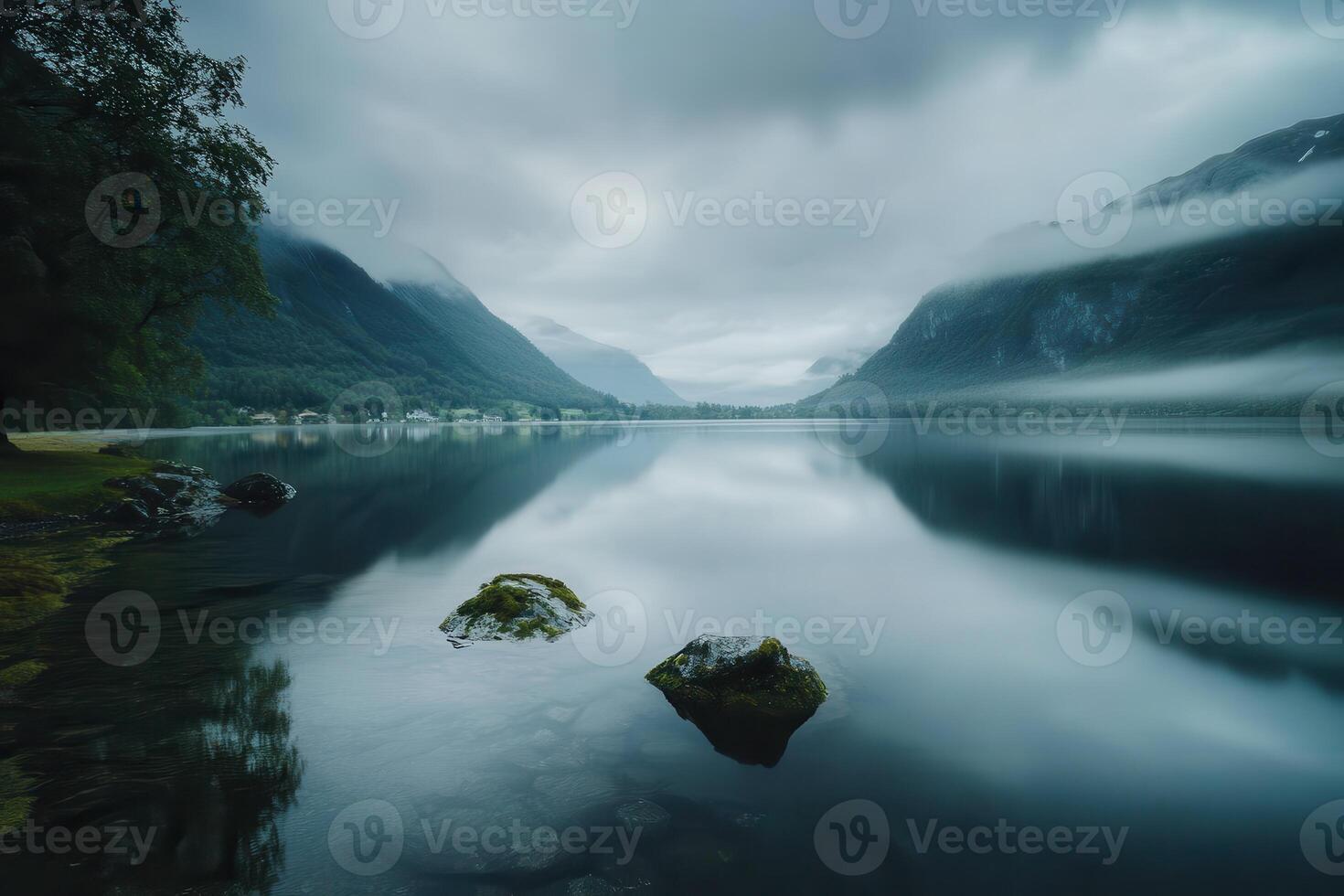 Serene Mountain Lake with Foggy Sky and Reflection photo