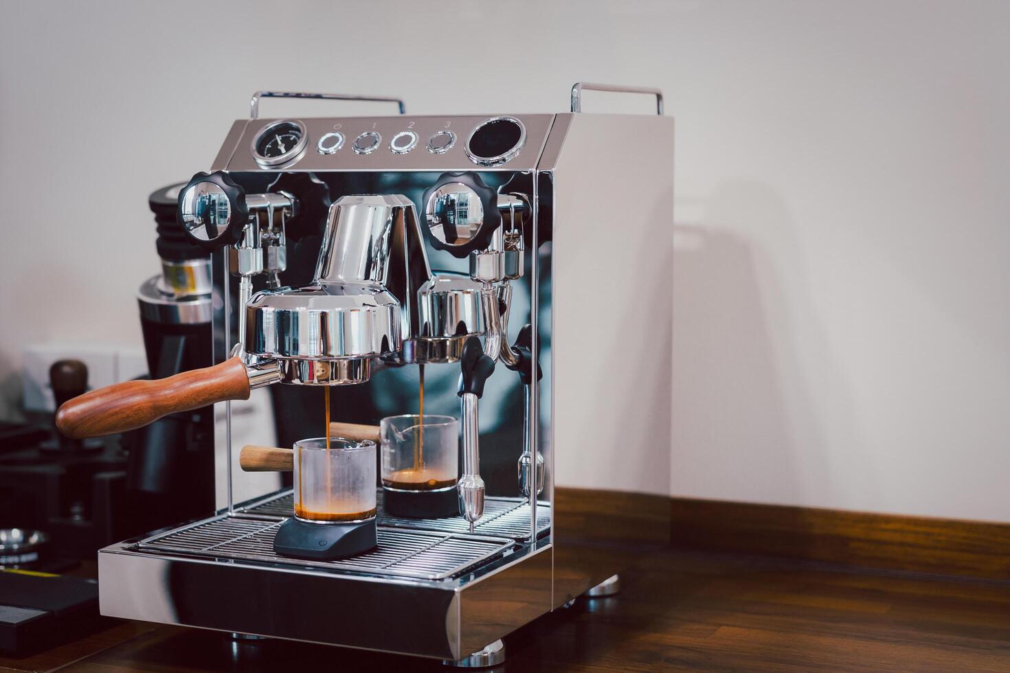 Espresso machine brewing a fresh coffee. photo