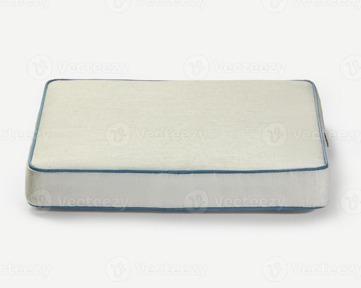 Comfortable pet bed resting on white background photo