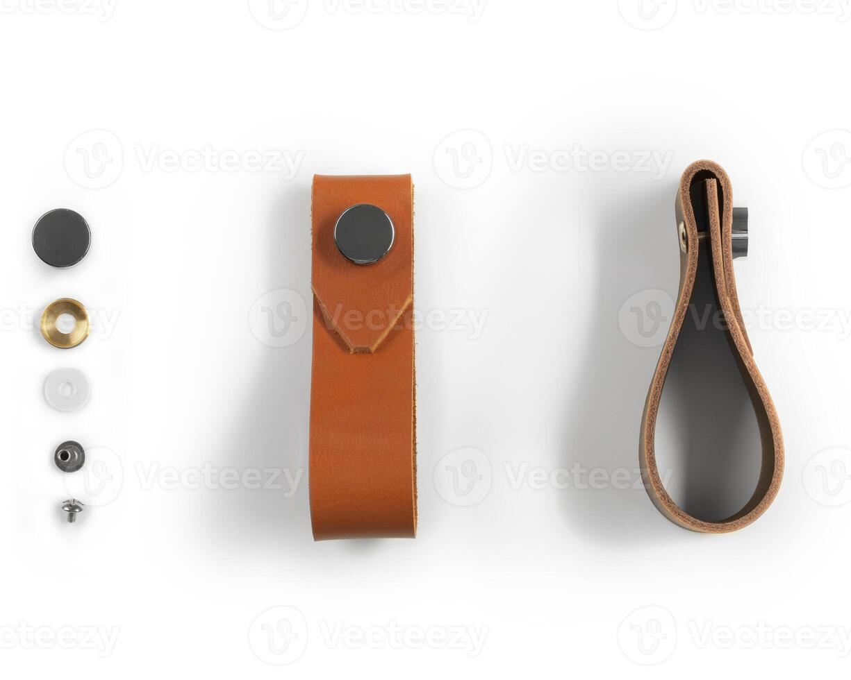 Leather drawer pull handles with mounting hardware on white background photo