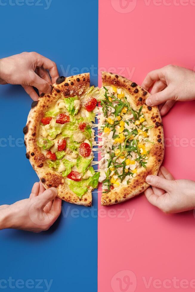 Hands taking slices of pizza with different toppings on colorful background photo