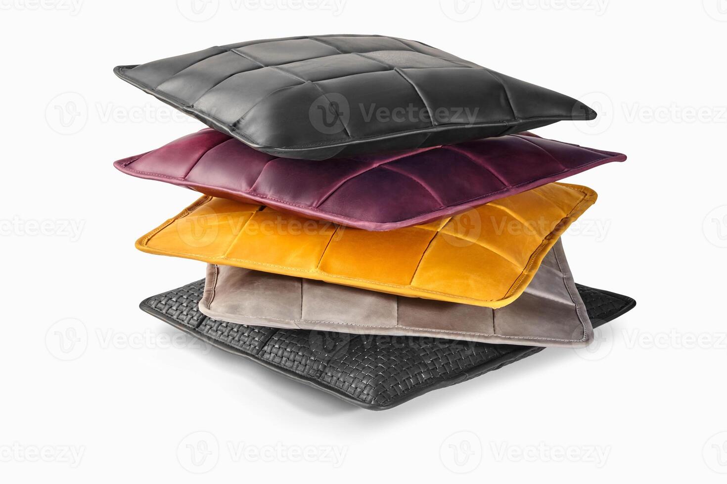 Stack of colorful leather pillows creating modern and stylish home decor photo