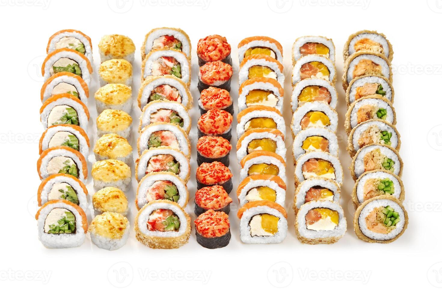 Variety of delicious uramaki sushi rolls with different toppings displayed on white background photo