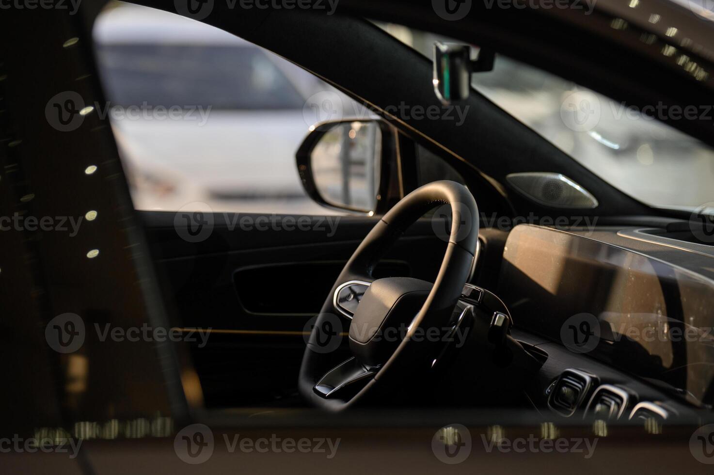A car's dashboard and steering wheel photo